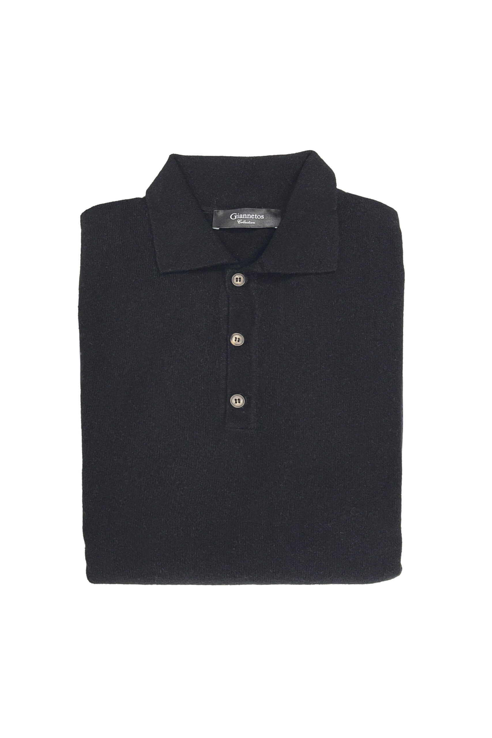 Folded black polo shirt with a brand label on a white background