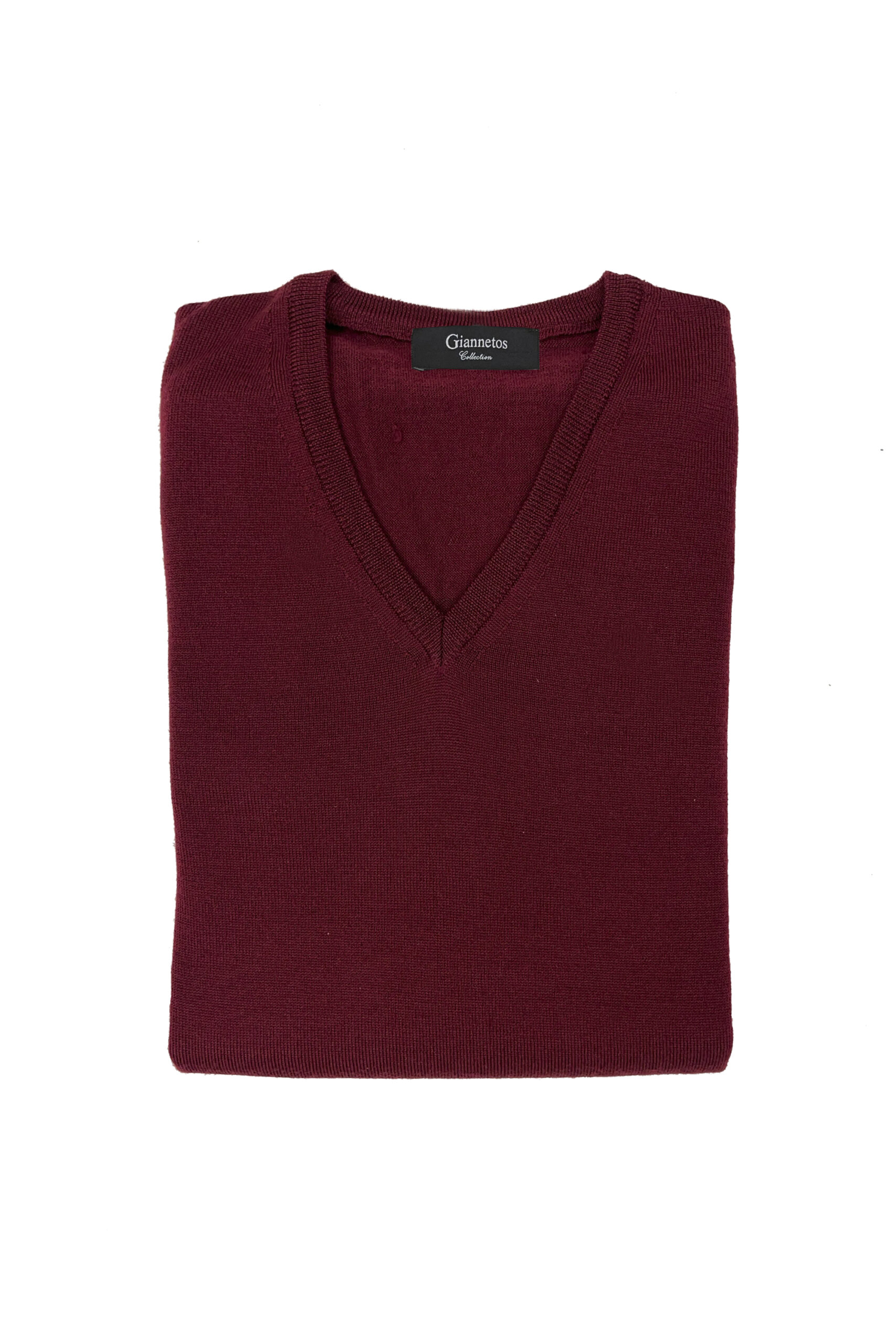 Folded burgundy sweater with a brand label on a white background