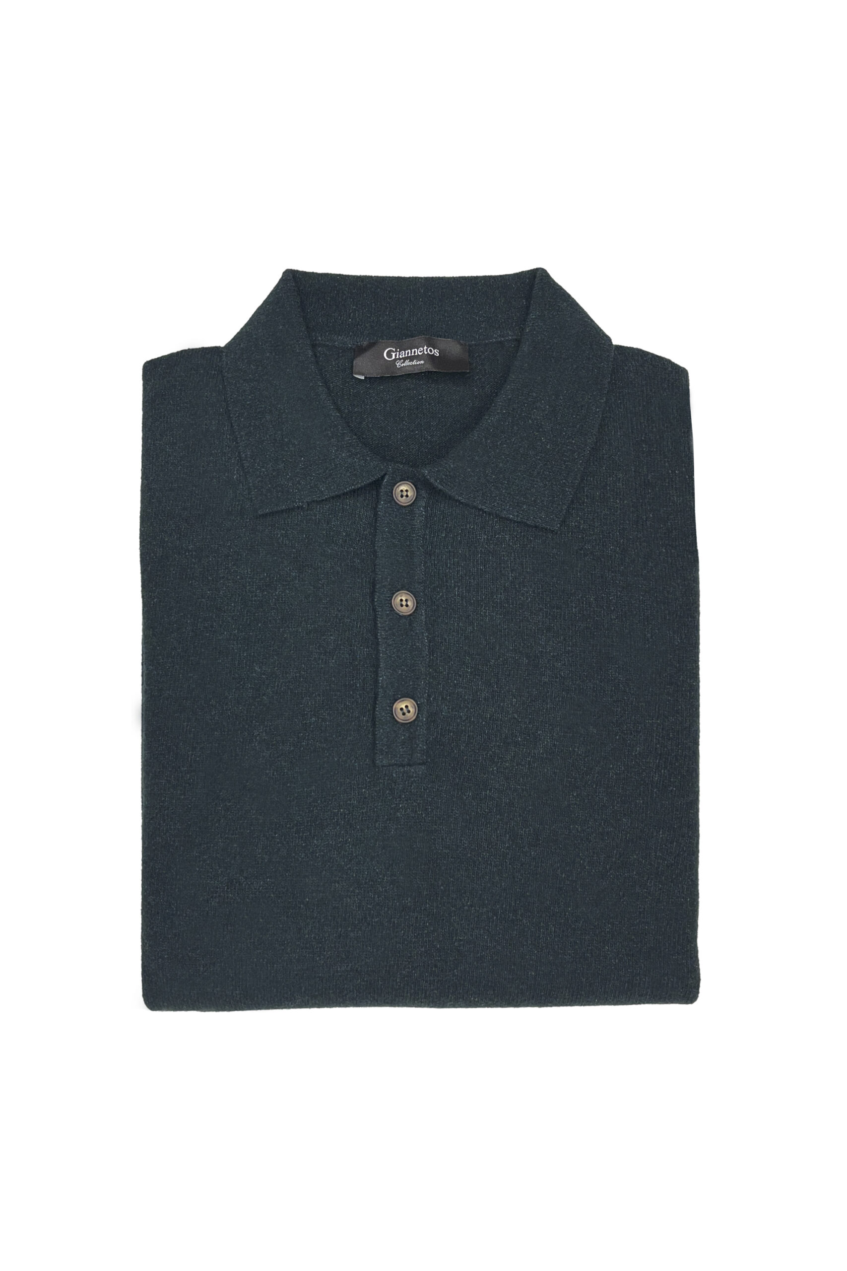 Folded dark green polo shirt with a brand label on a white background